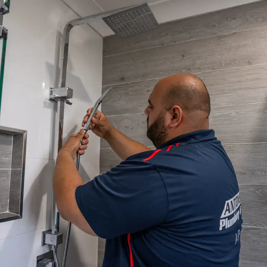 Antons plumber working on bathroom plumbing