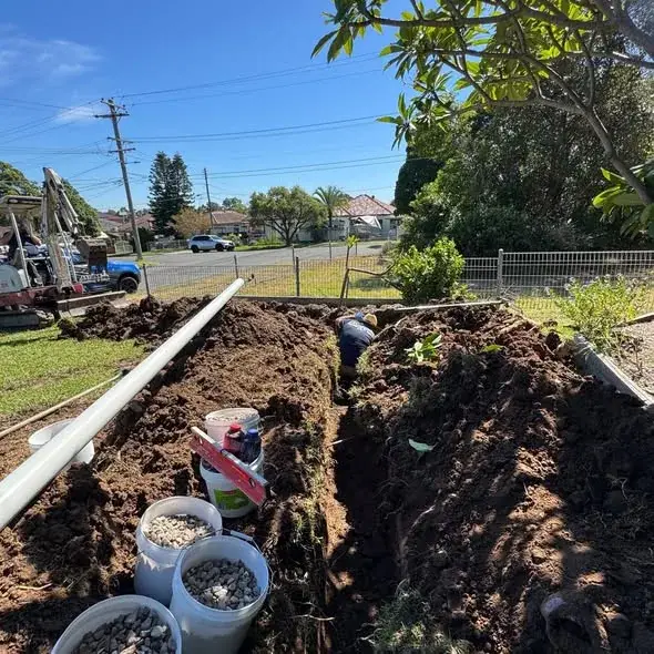 Drainage trench and underground pipework on a plumbing job